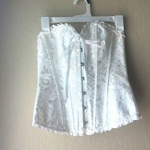White, laced corset in size small.
